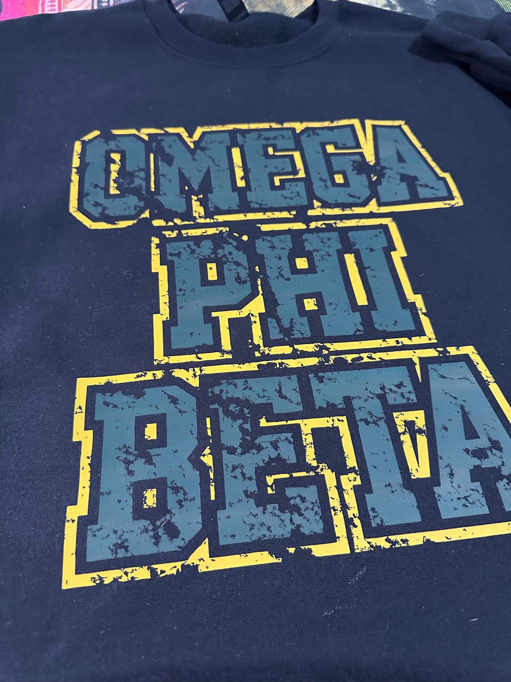 Omega Phi Beta - Distressed sweater.