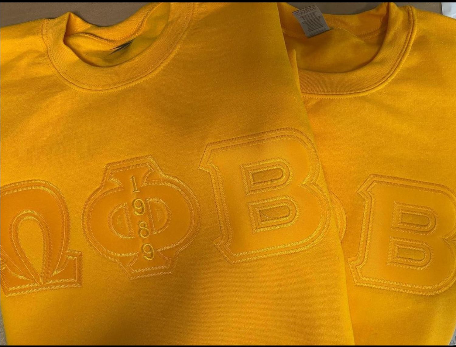 OMEGA PHI BETA  GOLD GREEK LETTERED SWEATER