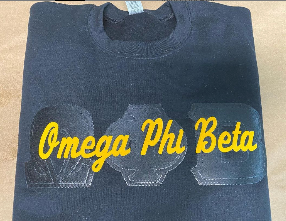 OMEGA PHI BETA - BLACK OUT CREWNECK